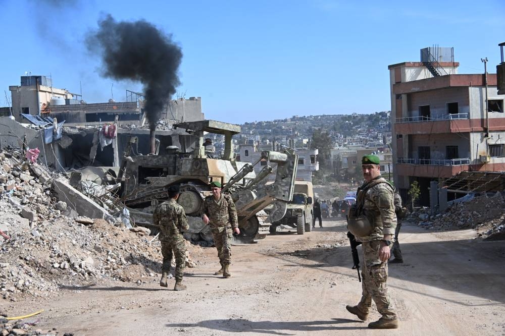 AITAROUN MUNICIPALITY, LEBANON - FEBRUARY 02: Lebanese people begin to enter municipality, where Lebanese army units are stationed after the Israeli army withdrew from the Aitaroun municipality, southern Lebanon on February 02, 2025. (Photo by Houssam Shbaro/Anadolu via Getty Images)